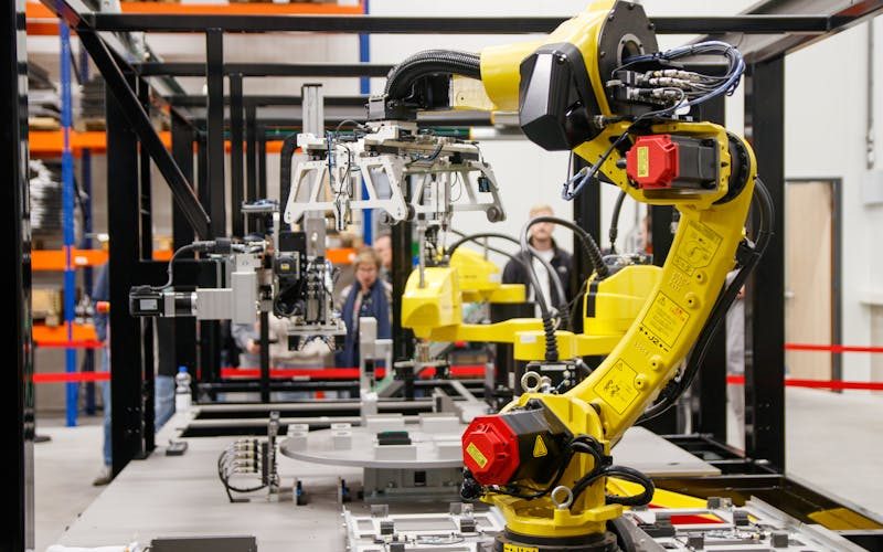 Automated robotic arm working on a modern production line