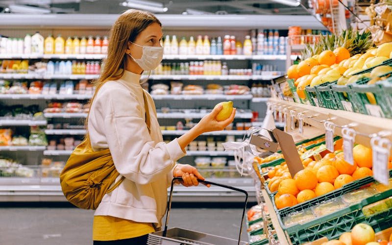 Cashier assisting a customer at a retail checkout counter